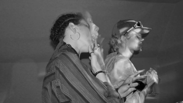 shared scene, blurred, cigarette and wine glass